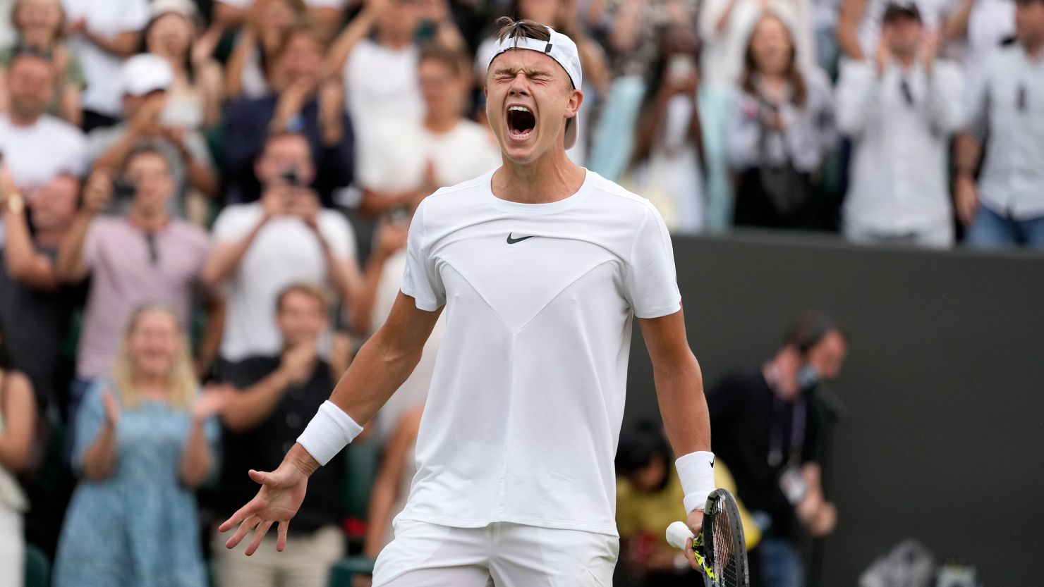 Denmark's Holger Rune celebrates after beating Spain's Alejandro Davidovich Fokina in a men's singles match on day six of the Wimbledon tennis championships in London, Saturday, July 8, 2023.