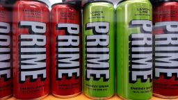 Various flavors of the energy drink PRIME for sale in a shop window in London.