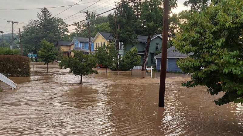 NextImg:Trapped drivers swam out of their cars. A woman died after being swept away by floodwaters. What to know about the heavy rainfall hitting the Northeast | CNN