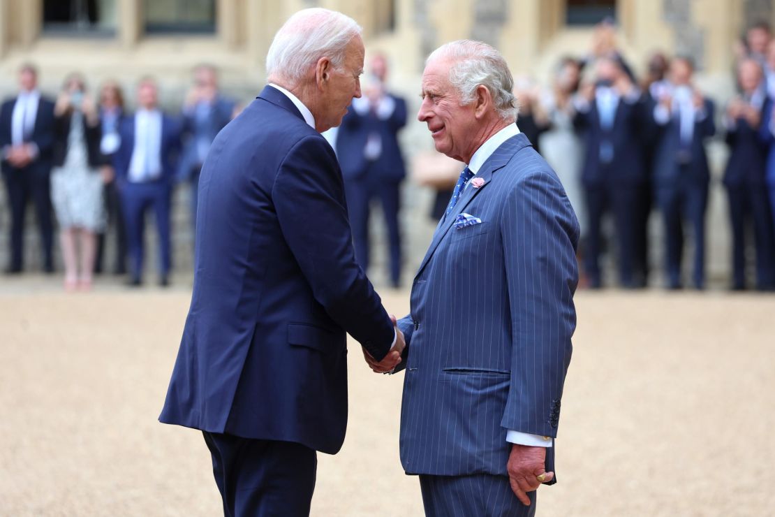 WINDSOR, ENGLAND - JULY 10: The President of the United States, Joe Biden shakes hands with King Charles III in the Quadrangle at Windsor Castle on July 10, 2023 in Windsor, England.
