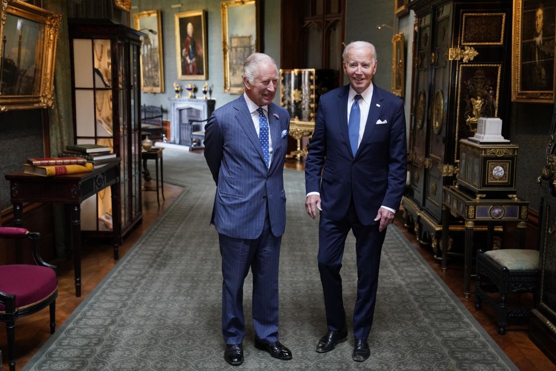 WINDSOR, ENGLAND - JULY 10: King Charles III and US President Joe Biden pose in the Grand Corridor at Windsor Castle on July 10, 2023 in Windsor, England. 