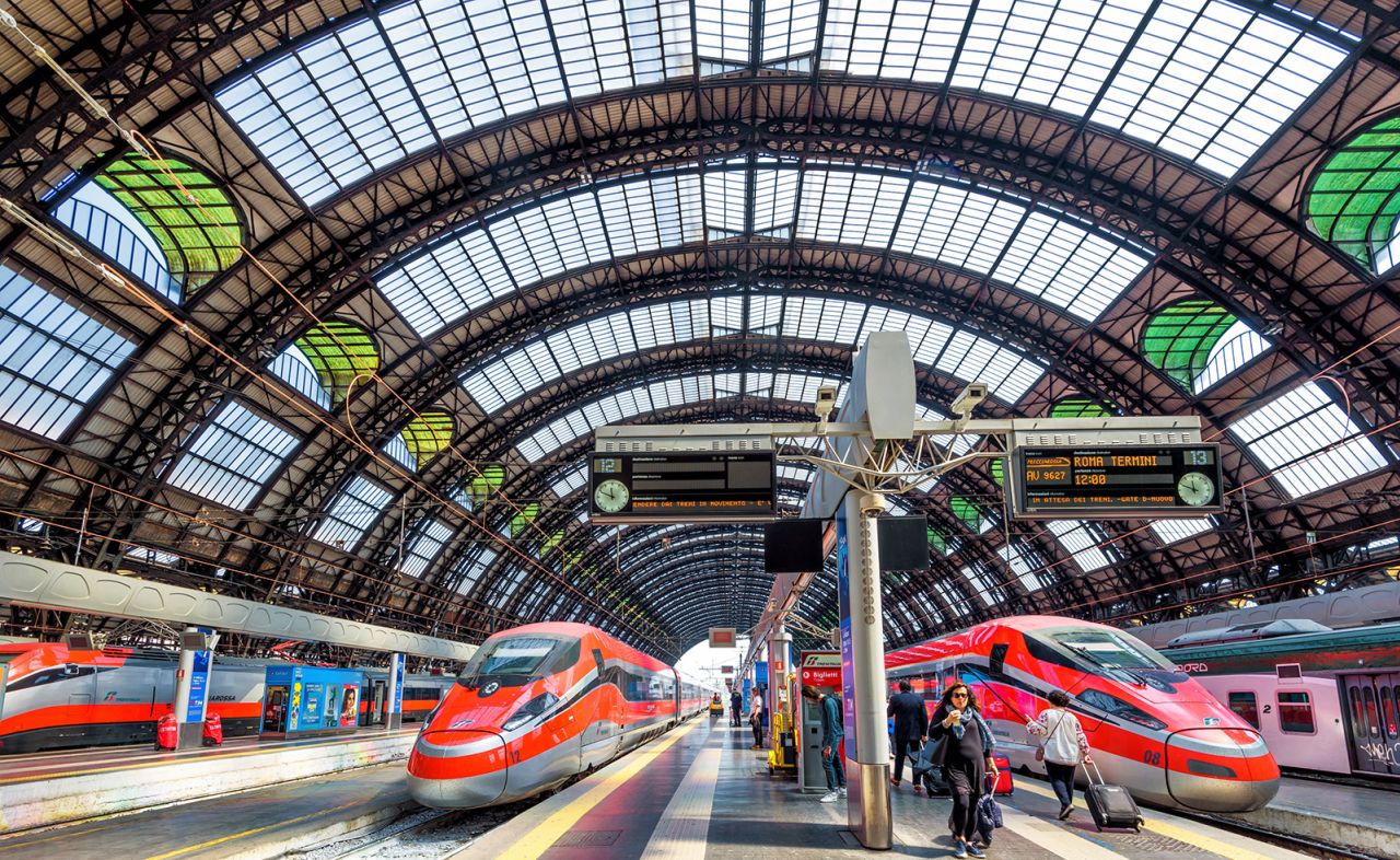 Milan, Italy - May 17, 2017: Modern high-speed trains at the railway Milan Central Station. Industrial landmark and tourist place of Milan. Concept of travel and transport across Milan and Europe.