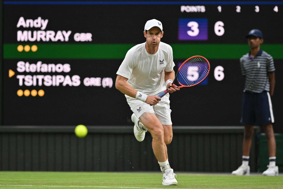 Britain's Andy Murray runs to play a return against Greece's Stefanos Tsitsipas during their men's singles tennis match on the fourth day of the 2023 Wimbledon Championships at The All England Tennis Club in Wimbledon, southwest London, on July 6, 2023. (Photo by Glyn KIRK / AFP) / RESTRICTED TO EDITORIAL USE (Photo by GLYN KIRK/AFP via Getty Images)
