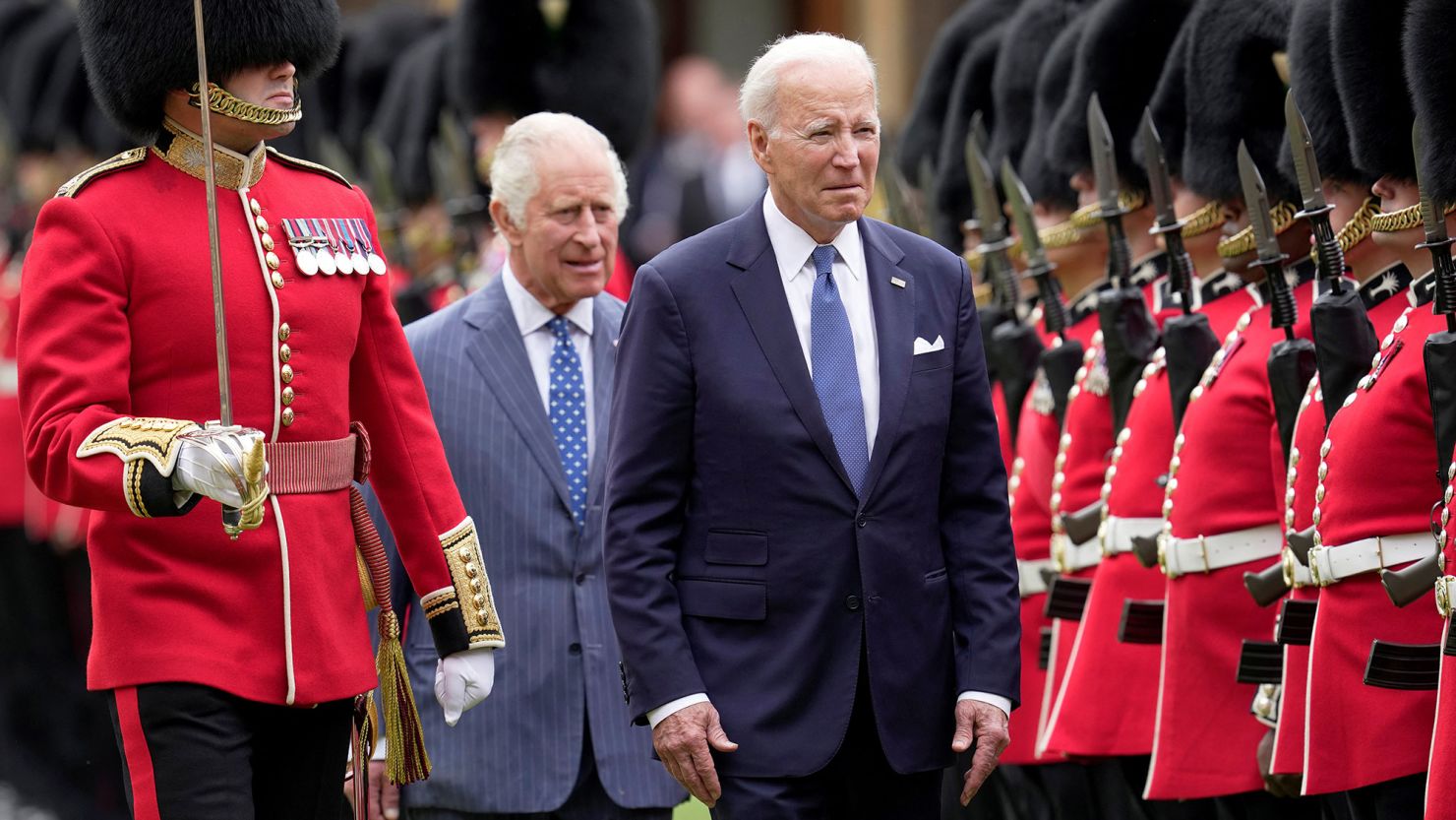U.S. President Joe Biden and Britain's King Charles review an honorary guard at Windsor Castle in Windsor, England, Monday, July 10, 2023.  Kin Cheung/Pool via REUTERS