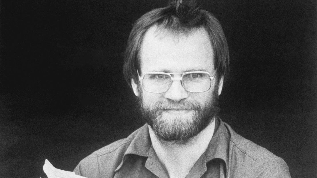 FILE - James W. Lewis, who was a one-time leading suspect in the 1982 murders of seven people who swallowed tainted Tylenol, holds documents at federal court, June 5, 1984, in Kansas City, Mo. Lewis, the suspect in the 1982 Tylenol poisonings that killed seven people in the Chicago area and triggered a nationwide scare has died, police confirmed on Monday, July 10, 2023. (Keith Myers/The Kansas City Star via AP, File)