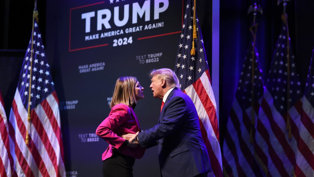 DAVENPORT, IOWA - MARCH 13: Former President Donald Trump is greeted by Iowa Gov. Kim Reynolds as he arrives for an event at the Adler Theatre on March 13, 2023 in Davenport, Iowa. Trump's visit follows those by potential challengers for the GOP presidential nomination, Florida Gov. Ron DeSantis and former U.N. Ambassador Nikki Haley, who hosted events in the state last week. (Photo by Scott Olson/Getty Images)