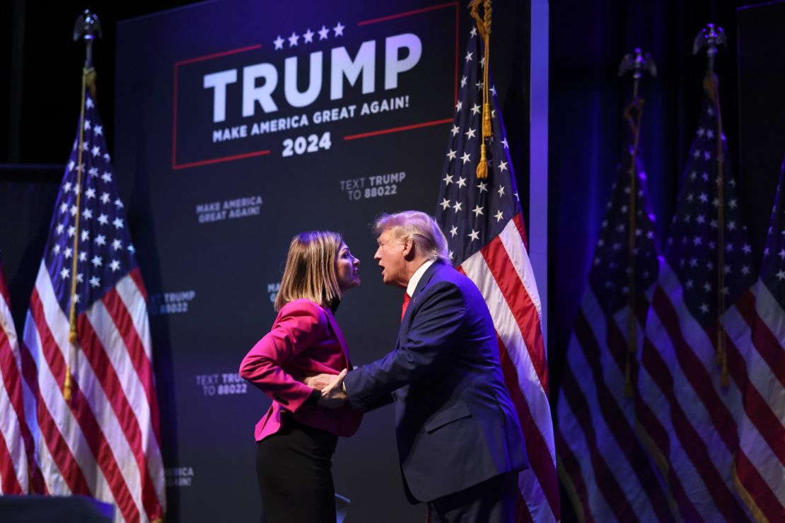 DAVENPORT, IOWA - MARCH 13: Former President Donald Trump is greeted by Iowa Gov. Kim Reynolds as he arrives for an event at the Adler Theatre on March 13, 2023 in Davenport, Iowa. Trump's visit follows those by potential challengers for the GOP presidential nomination, Florida Gov. Ron DeSantis and former U.N. Ambassador Nikki Haley, who hosted events in the state last week. (Photo by Scott Olson/Getty Images)