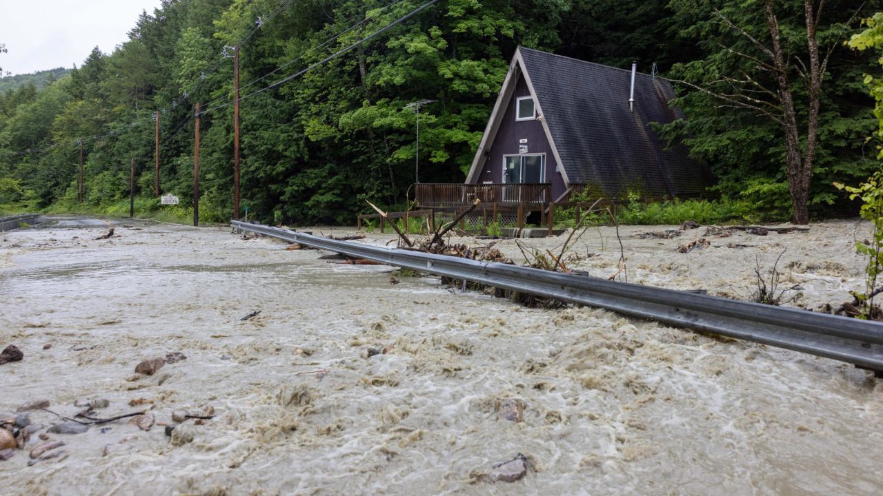 Water floods around a house on Route 11 on Monday in Windham, Vermont.