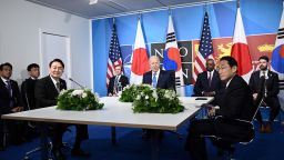 US President Joe Biden (C) flanked by US Secretary of Defense Lloyd Austin (C/R) and Secretary of State Antony Blinken (C/L) sits with South Korea's President Yoon Suk-Yeol (L) and Japan's Prime Minister Fumio Kishida (R) during a tri-lateral meeting on the sidelines of the NATO summit at the Ifema congress centre in Madrid, on June 29, 2022. (Photo by Brendan SMIALOWSKI / AFP) (Photo by BRENDAN SMIALOWSKI/AFP via Getty Images)