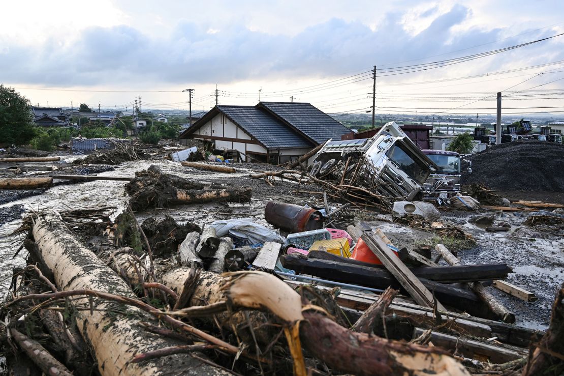 Debris from flooding sits in the road in the city of Kurume, Fukuoka prefecture, on July 10, 2023.