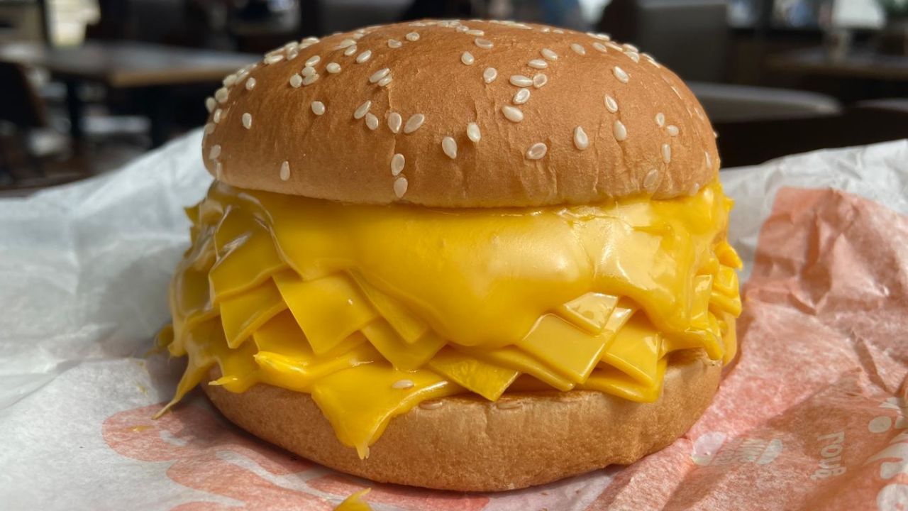 Burger King has introduced a new burger in Thailand with a jaw-dropping amount of cheese, in an apparent homage to the popularity of the dairy product among young people.
This week, the fast food chain introduced what it called the "real cheeseburger," a bun filled with as many as 20 slices of American cheese.
The item launched on Thai menus Sunday, and quickly went viral on social media in Thailand, with many users on TikTok posting videos of them trying the new offering.
At a Burger King in Bangkok on Tuesday, one customer who ordered the burger told CNN that she tried it for the first time after seeing it on social media. She said she loves cheese but this was a bit too much.
