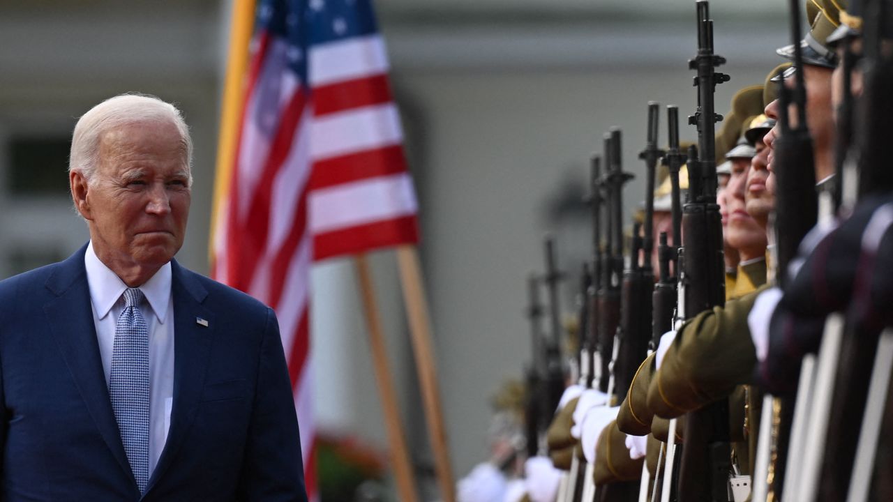 US President Joe Biden reviews a military honor guard with the Lithuanian President (not in picture) during an official welcome ceramony at the Presidential Palace as Biden arrives to attend a NATO Summit in Vilnius, Lithuania, on July 11, 2023. (Photo by ANDREW CABALLERO-REYNOLDS / AFP) (Photo by ANDREW CABALLERO-REYNOLDS/AFP via Getty Images)