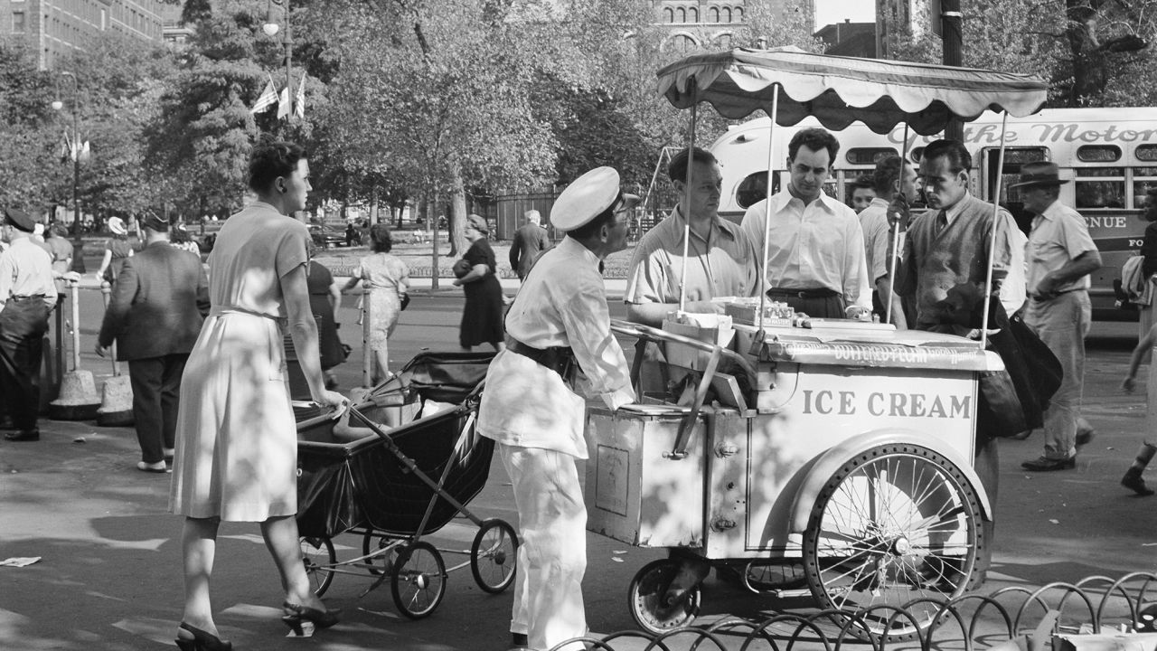 People line up for ice cream in New York, NY, circa 1947. 