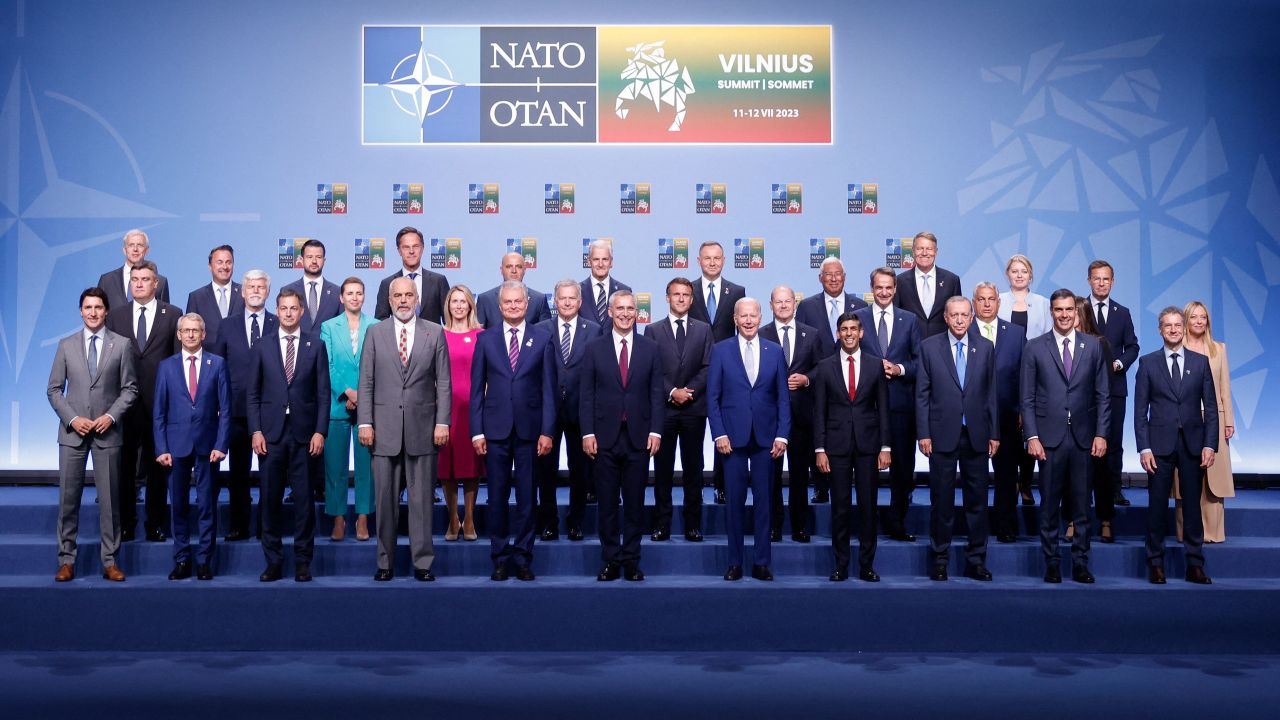 NATO Secretary General Jens Stoltenberg (C) poses for an official family photo with the participants of the NATO Summit in Vilnius on July 11, 2023. 