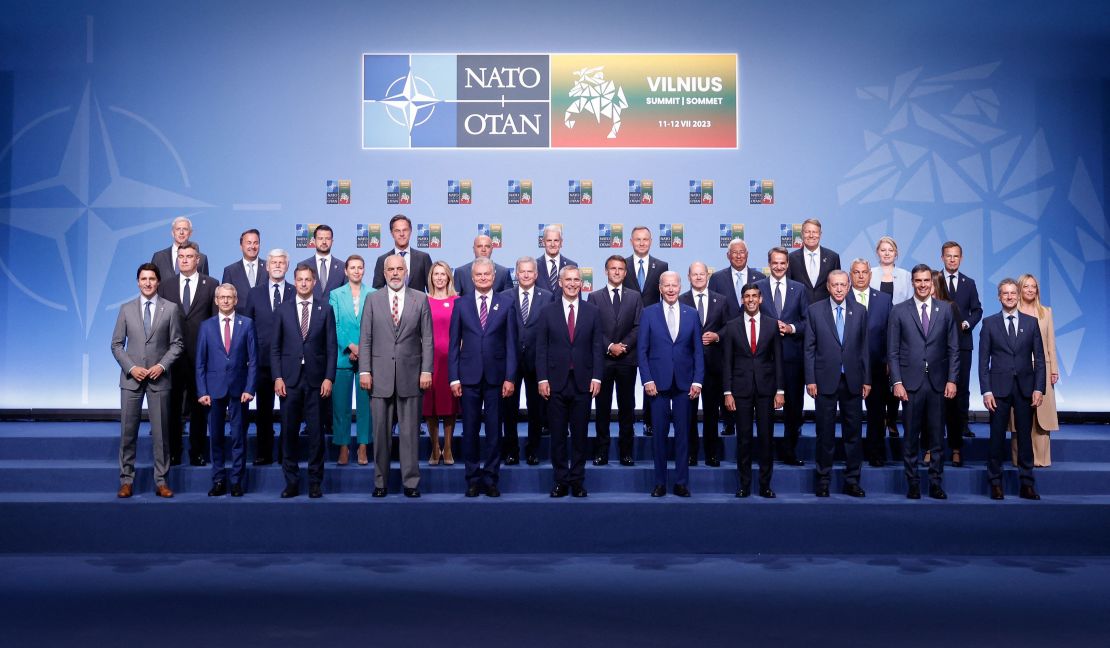 NATO Secretary General Jens Stoltenberg (C) poses for an official family photo with the participants of the NATO Summit in Vilnius on July 11, 2023. 