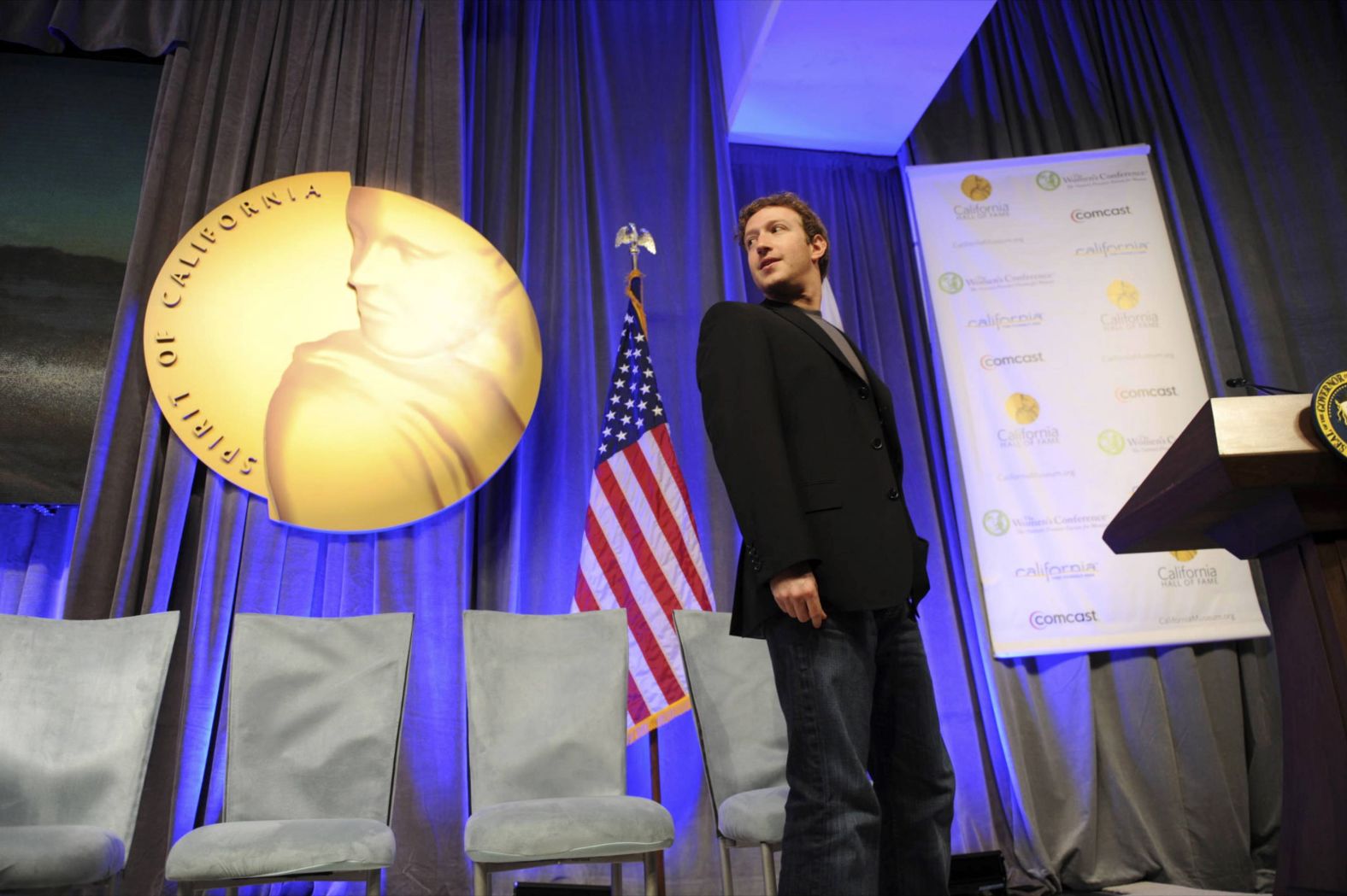 Zuckerberg walks on stage during his induction ceremony for the California Hall of Fame in December 2010. That month, he also signed the Giving Pledge, a public pledge to give away the majority of his wealth to philanthropic causes.