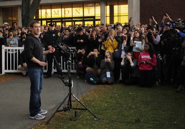 Students gather to listen as Zuckerberg speaks to reporters at Harvard University in November 2011. Zuckerberg was visiting Harvard and the Massachusetts Institute of Technology to recruit students for Facebook.  