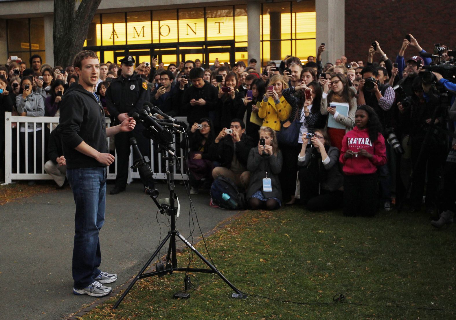 Students gather to listen as Zuckerberg speaks to reporters at Harvard University in November 2011. Zuckerberg was visiting Harvard and the Massachusetts Institute of Technology to recruit students for Facebook.  