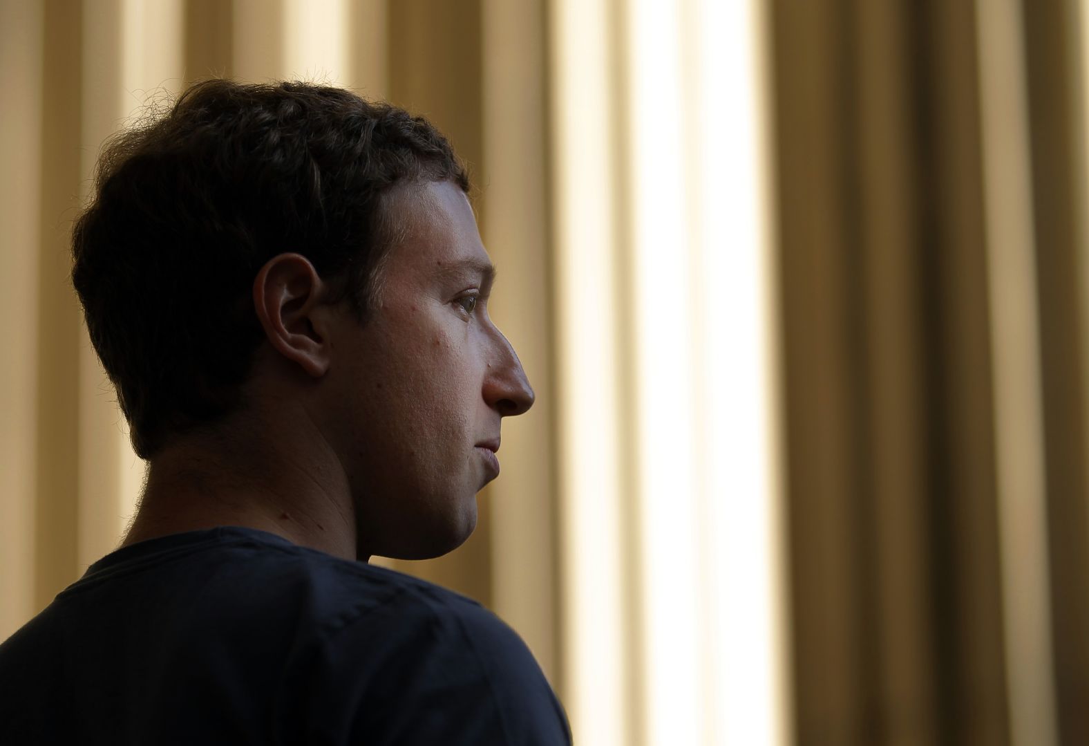 Zuckerberg speaks to reporters during a visit to the Massachusetts Institute of Technology in November 2011.