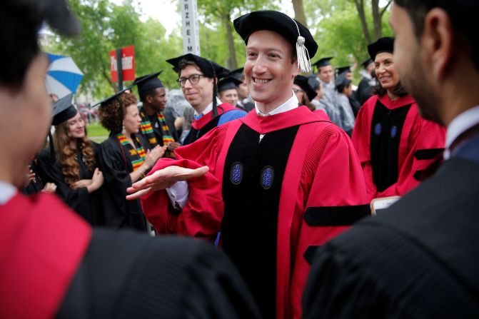 Zuckerberg greets graduating students before receiving an honorary degree at Harvard in 2017. Zuckerberg famously dropped out of Harvard to focus on building Facebook.