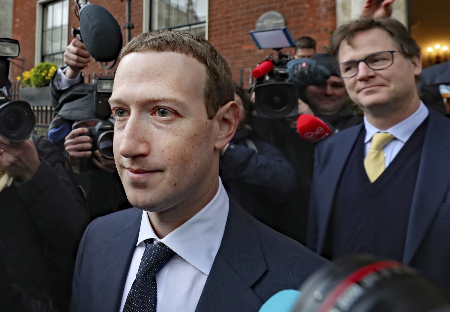 Zuckerberg leaves a hotel in Dublin, Ireland, with Nick Clegg, Facebook's head of global affairs, in February 2019. Clegg, a former UK deputy prime minister, defended Facebook's decision not to take action against inflammatory posts by US President Donald Trump, arguing that "defending free expression is important." Trump was later banned for two years in the wake of the US Capitol attacks on January 6, 2021.