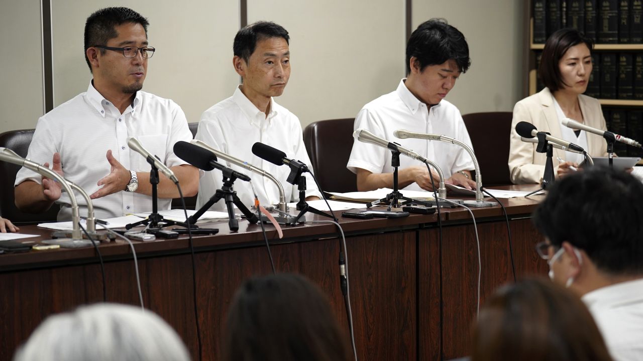 Lawyers speak during a news conference at Tokyo District Court Tuesday, July 11, 2023, in Tokyo. Japan's Supreme Court ruled Tuesday that restrictions imposed by a government ministry on a transgender female employee's use of restrooms at her workplace are illegal, in a landmark decision that could help promote LGBTQ+ rights in a country that still lacks anti-discrimination law for sexual minorities. (AP Photo/Eugene Hoshiko)