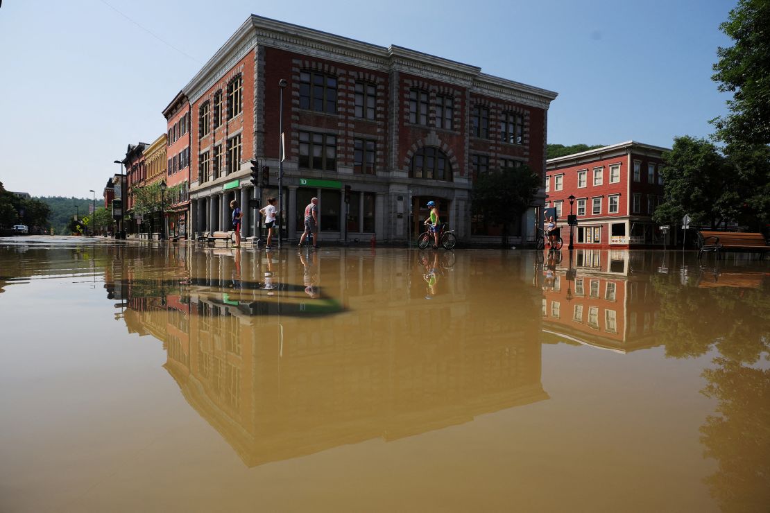 Residents assess flooding damage Tuesday in Montpelier, Vermont.
