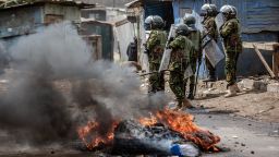 Kenya Police Officers try to gain control over a road with several burning barricades during demonstrations in Nairobi, Kenya on July 12, 2023.