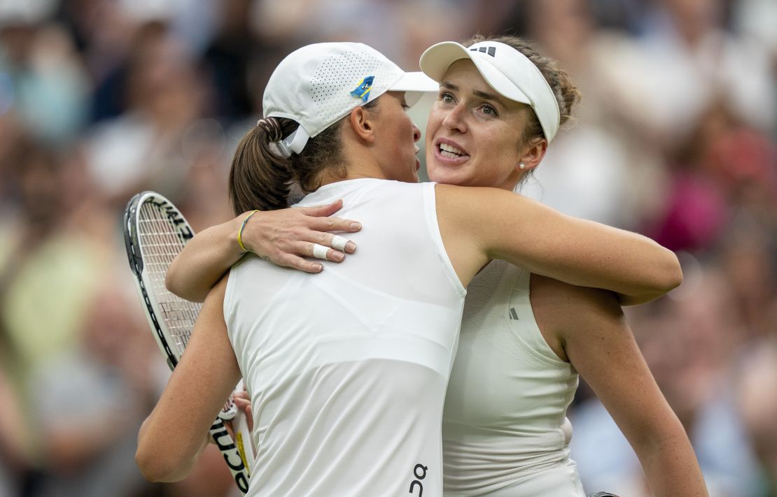 Jul 11, 2023; London, United Kingdom; Elina Svitolina (UKR) at the net with Iga Swiatek (POL) after their match on day nine at the All England Lawn Tennis and Croquet Club.  Mandatory Credit: Susan Mullane-USA TODAY Sports