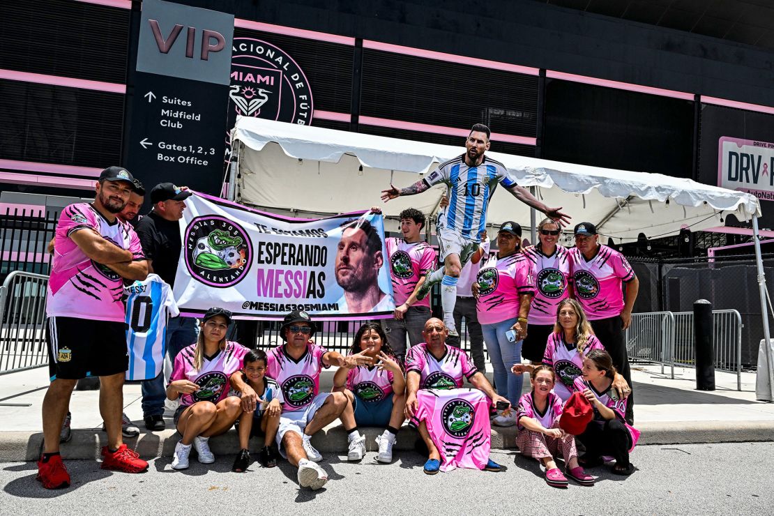 Fans of Argentina's Lionel Messi wait for his arrival at the DRV PNK Stadium in Fort Lauderdale, Florida on July 11, 2023, ahead of his debut in the Major League Soccer (MLS) with Inter Miami. Messi landed in Florida on Tuesday ahead of putting the final touches on his move to US Major League Soccer club Inter Miami, ESPN television footage showed. Inter Miami announced July 7, 2023, it will hold a presentation event called 'The Unveil' on July 16 at its home stadium. Messi said last month that he was moving to the MLS club after allowing his contract at Paris Saint-Germain to run out. (Photo by CHANDAN KHANNA / AFP) (Photo by CHANDAN KHANNA/AFP via Getty Images)