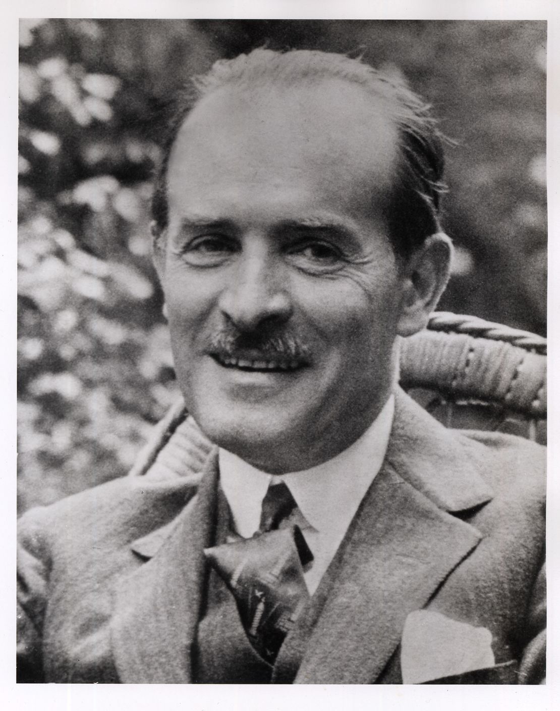 A portrait of René Gimpel taken in the garden of his home in Paris.