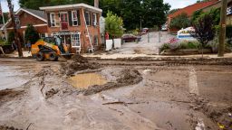 Workers remove mud from Main street after heavy rains in Highland Falls, New York, on July 10, 2023. The northeastern United States was inundated July 10, 2023, with heavy rain and flooding across several states a day after storms and flash floods washed out highways and killed one person in New York state. Heavy rains in New York state on July 9, 2023, turned streets into raging waterways, washing out bridges, leaving roads impassable and leading Governor Kathy Hochul to declare states of emergency in two counties. 