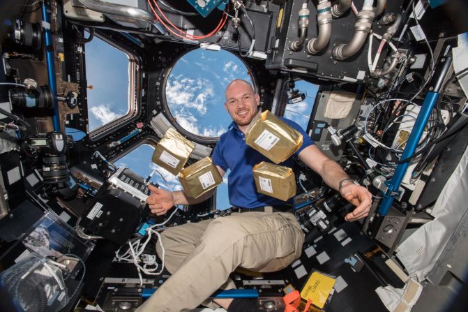 European Space Agency astronaut Alexander Gerst with "Earth Guardian" seeds aboard the ISS in 2018, as part of an experiment intended to teach students the importance of biodiversity. After returning to Earth, wildflower seeds were distributed to schools in Germany, where they were grown and their development compared to plants grown from regular seeds.