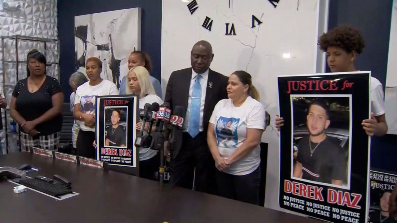 Attorney Ben Crump holdis a press conference on July 8, with the family of Derek Diaz.  Diaz was shot and killed in an altercation with Orlando Police officers.  