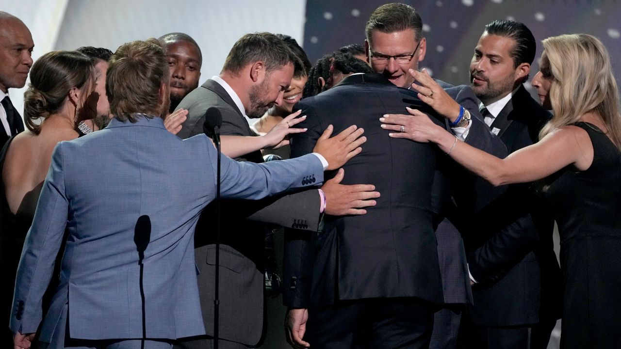 Damar Hamlin hugs members of the Buffalo Bills training staff while presenting them the Pat Tillman award for service at the ESPY awards on Wednesday at the Dolby Theatre in Los Angeles.