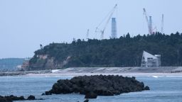 Tokyo Electric Power Co.'s (Tepco) Fukushima Dai-ichi nuclear power plant, rear, in Okuma, Fukushima Prefecture, Japan, where Japan is expected to discharge more than a million cubic meters of treated water from the Fukushima nuclear disaster site into the Pacific Ocean.