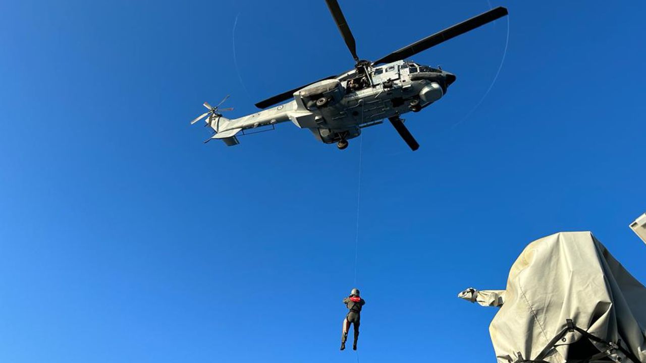 This undated handout image provided by Greece's coast guard, shows a helicopter mission as an overcrowded fishing boat later capsized and sank off southern Greece on June 14.