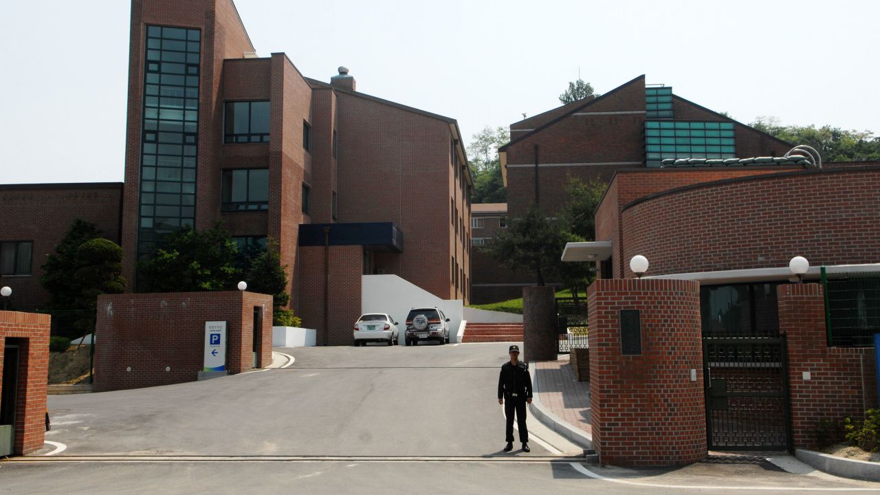 A security guard stands outside Hanawon in Anseong, South Korea, on May 28, 2009. 