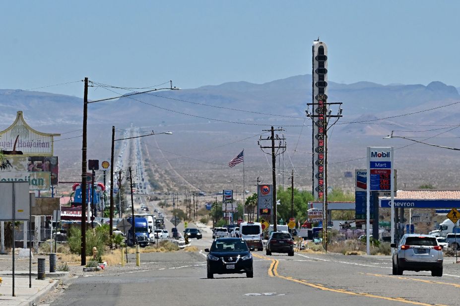 The "World's Tallest Thermometer" shows temperatures reaching triple digits in Baker, California, on July 11.