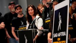 SAG-AFTRA president Fran Drescher, center, and SAG-AFTRA National Executive Director and Chief Negotiator Duncan Crabtree-Ireland, center right speak alongside SAG-AFTRA members during a press conference announcing a strike by The Screen Actors Guild-American Federation of Television and Radio Artists on Thursday, July, 13, 2023, in Los Angeles. This marks the first time since 1960 that actors and writers will picket film and television productions at the same time. 