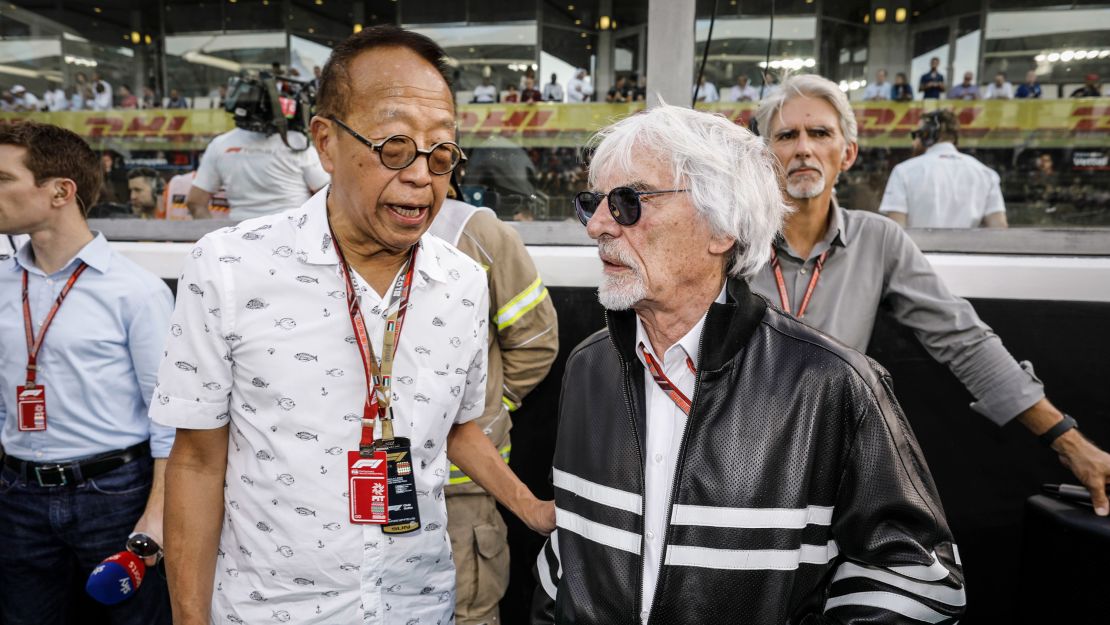 Ong (left), seen with former F1 boss Bernie Ecclestone at the Abu Dhabi Grand Prix in 2018.