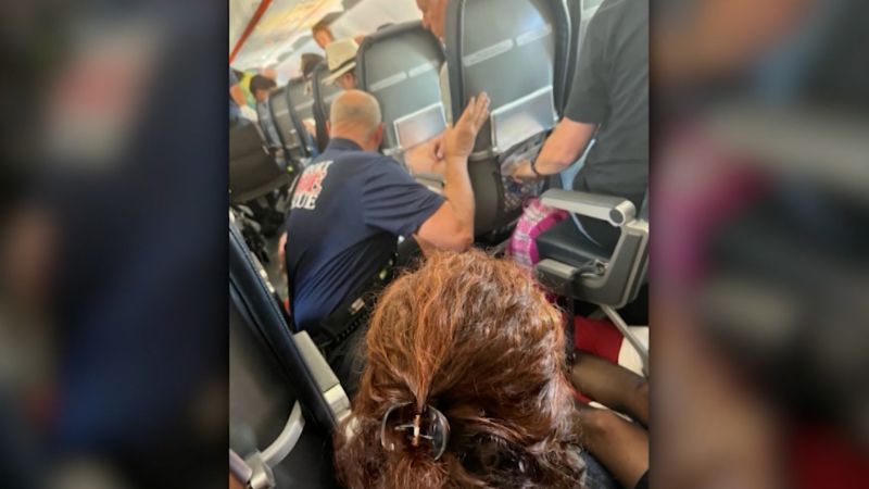 Passenger says she saw flight attendant’s body hit plane ceiling | CNN