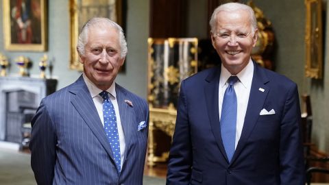 WINDSOR, ENGLAND - JULY 10: King Charles III and US President Joe Biden pose in the Grand Corridor at Windsor Castle on July 10, 2023 in Windsor, England. The President is visiting the UK to further strengthen the close relationship between the two nations and to discuss climate issues with King Charles III. (Photo by Andrew Matthews - WPA Pool/Getty Images)