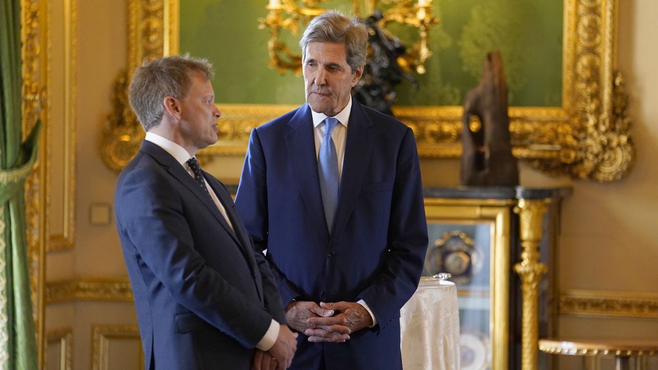 UK Secretary of State for Energy Security Grant Shapps, left, and US Special Presidential Envoy for Climate John Kerry chat in the castle's Green Drawing Room.