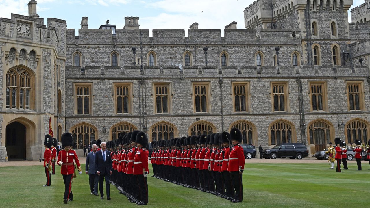 The pair inspect an honor guard formed by the Welsh Guards, during a ceremonial welcome in the Quadrangle at the royal residence.