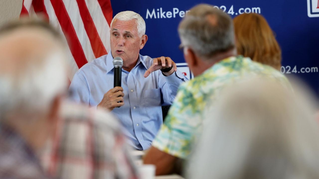 Former Vice President Mike Pence speaks with guests during a campaign stop in Holstein, Iowa, on July 6, 2023. 