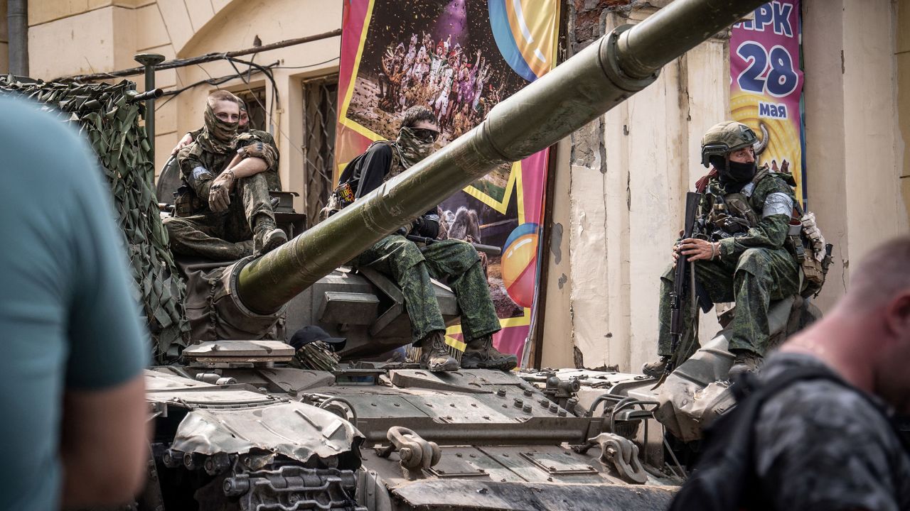 Members of Wagner group sit atop of a tank in a street in the city of Rostov-on-Don, on June 24, 2023.