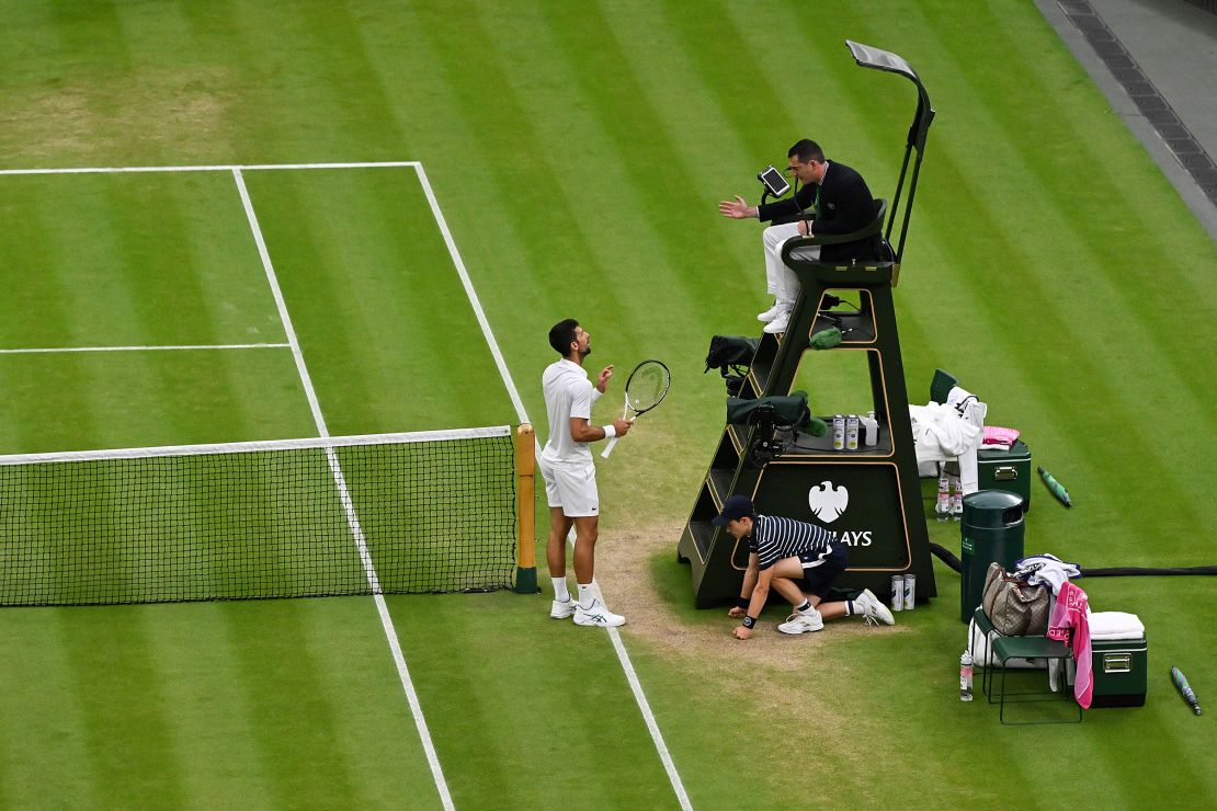 Djokovic argues with the referee after a points deduction for shouting.