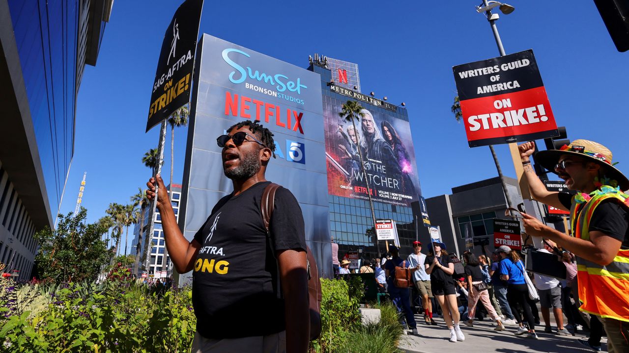 SAG-AFTRA actors strike against the Hollywood studios as they join the Writers Guild of America (WGA) on the picket line outside of Netflix offices in Los Angeles on Friday.