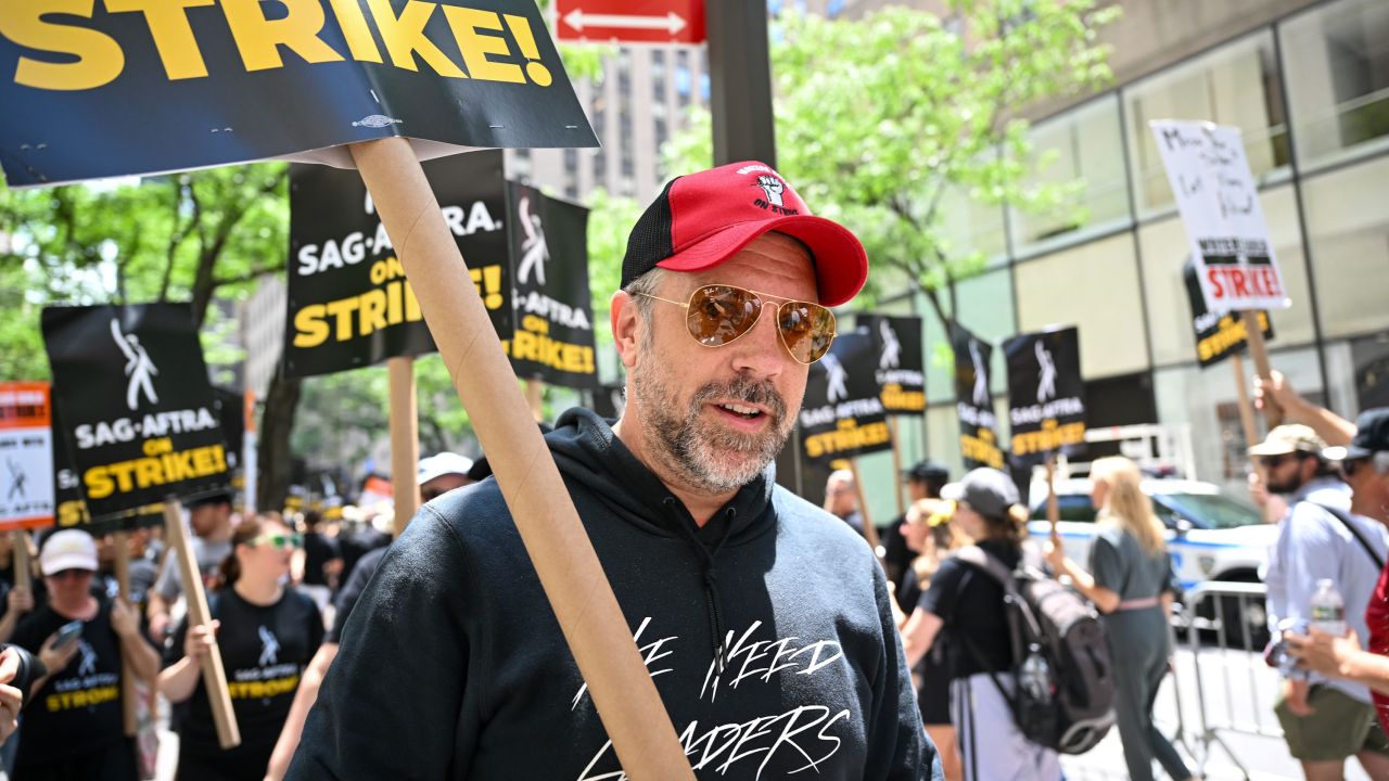 Jason Sudeikis joins members of the Writers Guild of America East and SAG-AFTRA as they walk the picket line outside NBC Rockefeller Center on Friday.